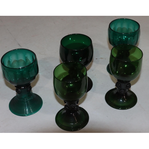 52 - A pair of 18th Century Bristol green round bulbous shaped glasses with raised stems on round sweepin... 