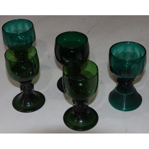 52 - A pair of 18th Century Bristol green round bulbous shaped glasses with raised stems on round sweepin... 