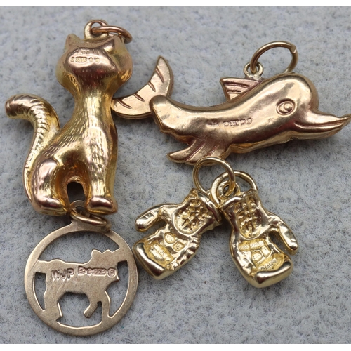 525 - 7 various 9ct gold charms, 15 grams gross