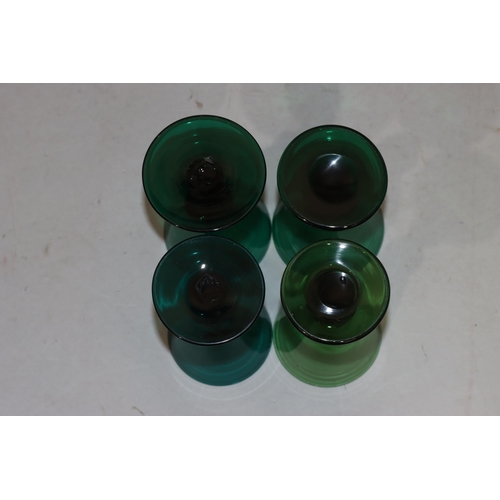 54 - 4 odd Georgian Bristol green round trumpet shaped glasses with knob stems on round bases (4)