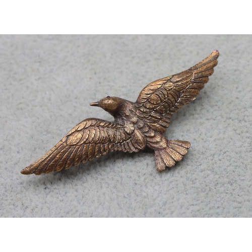 540 - A 15ct gold brooch in the form of a bird in flight, 5.5cm wide, 6.2 grams