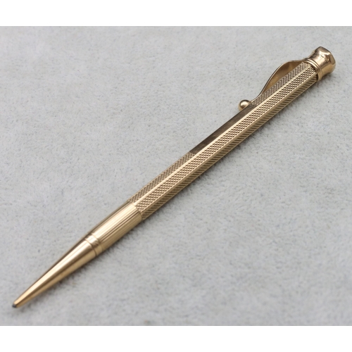 542 - A 9ct gold Baker's Perm-Point hexagonal propelling pencil with engine turned decoration, overall wei... 