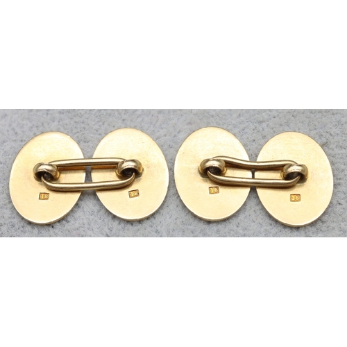 544 - A pair of 18ct gold gentlemen's oval cufflinks engraved with crest 