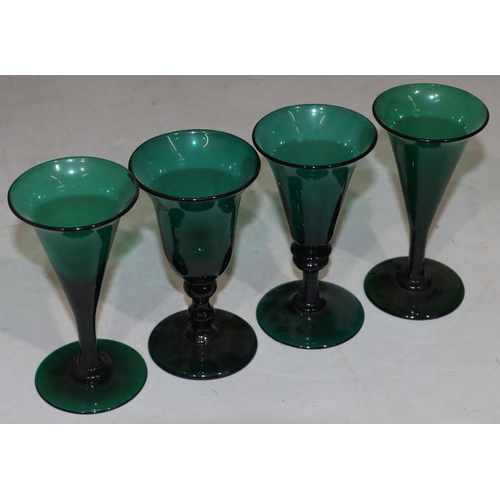 55 - A pair of Georgian Bristol green round trumpet shaped glasses on round bases, 13cm high and 2 simila... 