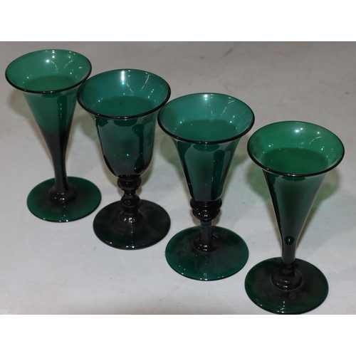 55 - A pair of Georgian Bristol green round trumpet shaped glasses on round bases, 13cm high and 2 simila... 