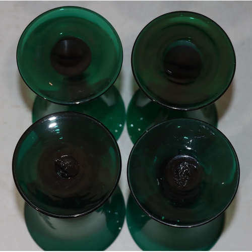 55 - A pair of Georgian Bristol green round trumpet shaped glasses on round bases, 13cm high and 2 simila... 