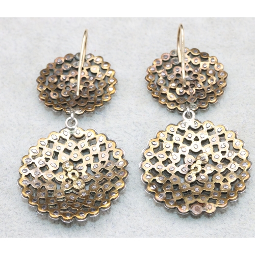 556 - A pair of Georgian cut steel large circular drop earrings, 6.5cm high (boxed)