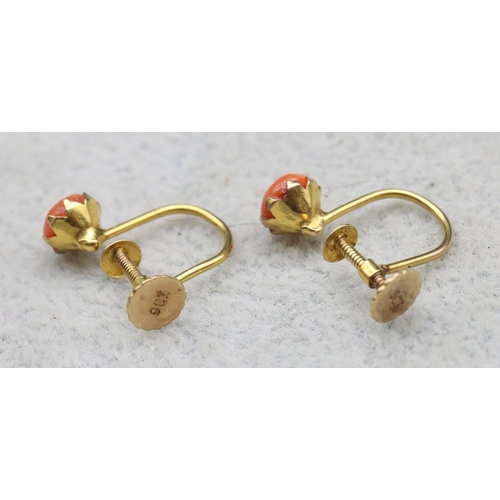 557 - A pair of 9ct gold coral earrings with screw backs, 0.9 grams gross (boxed)