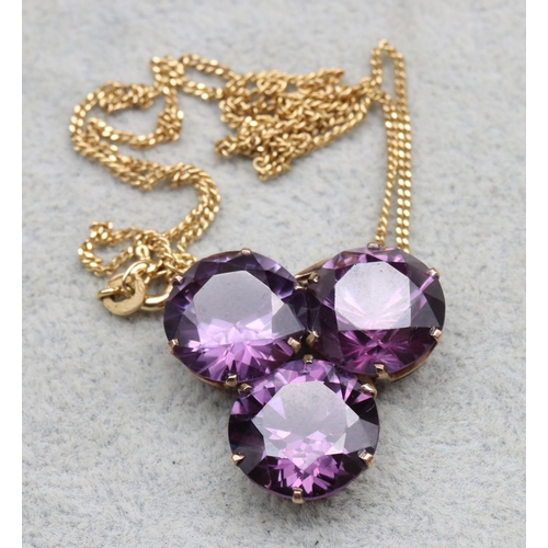 561 - A gold pendant set with 3 amethysts, with 9ct gold chain, chain 2.6 grams, brooch and chain 11.5gram... 