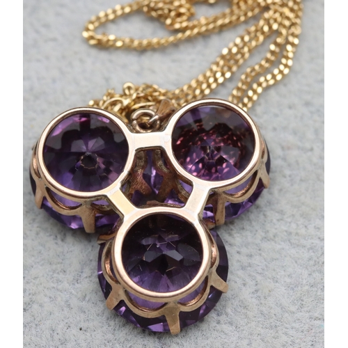 561 - A gold pendant set with 3 synthetic Alexandrite, with 9ct gold chain, chain 2.6 grams, brooch and ch... 