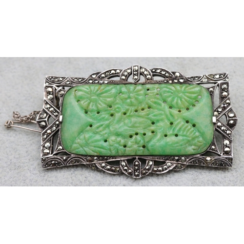 565 - A silver and jade rectangular shaped brooch set with Marcasite, 6.5cm wide, overall weight 21.6 gram... 