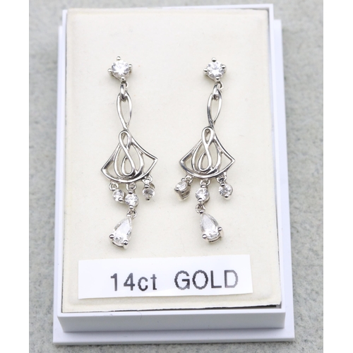 569 - A pair of 14ct white gold drop earrings mounted with clear stones, 3.5cm long, 2.6 grams gross