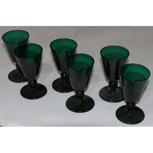 57 - A set of 6 18th/19th Century Bristol green glass round trumpet shaped glasses with knob stems on rou... 