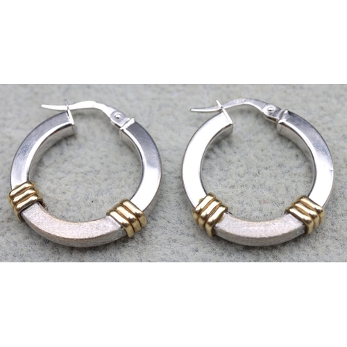 570 - A pair of 9ct white and yellow gold hoop earrings, 3.2 grams