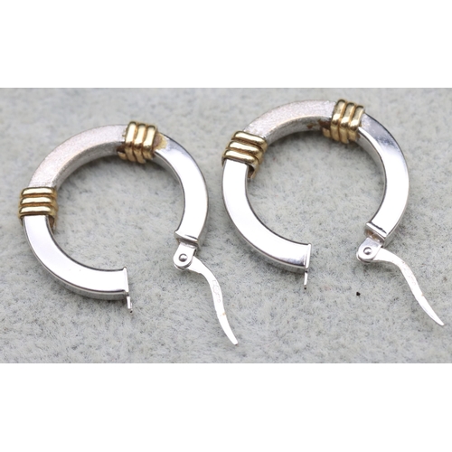 570 - A pair of 9ct white and yellow gold hoop earrings, 3.2 grams