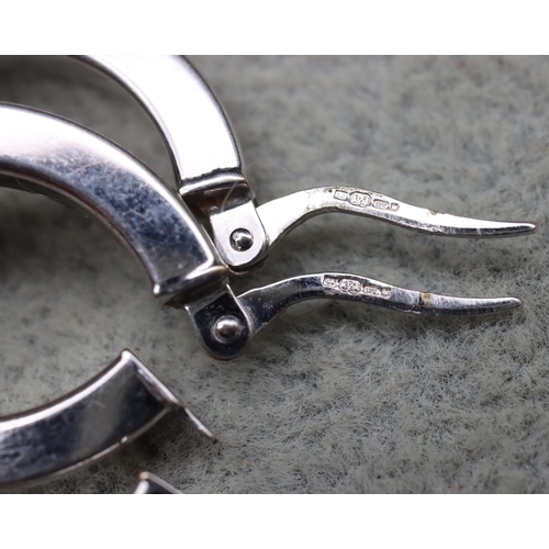 570 - A pair of 9ct white and yellow gold hoop earrings, 3.2 grams