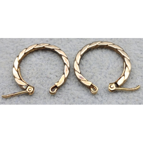 571 - A pair of 9ct gold hoop earrings, 1.7 grams