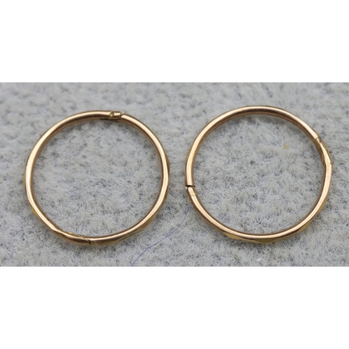 573 - A pair of 9ct gold sleeper earrings, 0.5 grams