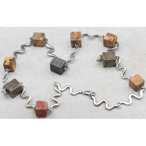 576 - An Artisan made silver and square hardstone necklace, 69.5cm long