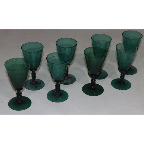 58 - A set of 8 Georgian Bristol green round trumpet shaped glasses with knob stems with engraved leaf de... 