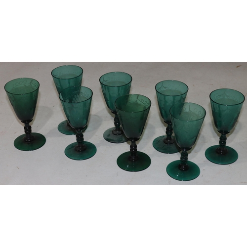 58 - A set of 8 Georgian Bristol green round trumpet shaped glasses with knob stems with engraved leaf de... 