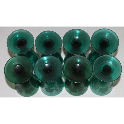 58 - A set of 8 Georgian Bristol green round trumpet shaped glasses with knob stems with engraved leaf de... 