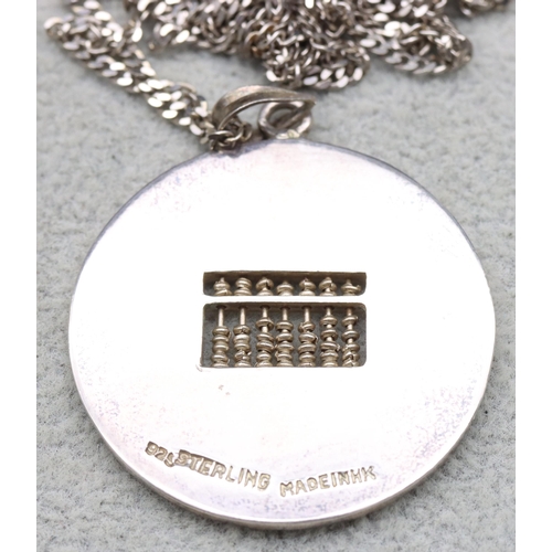 593 - A Chinese silver Abacus circular pendant with chain, 12 grams