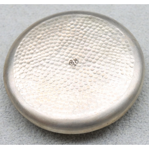 595 - An 800 silver coloured metal circular compact with embossed hinged lid, 40.1 grams gross