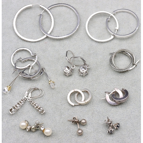 596 - 12 various pairs of silver earrings, 39.7 grams gross