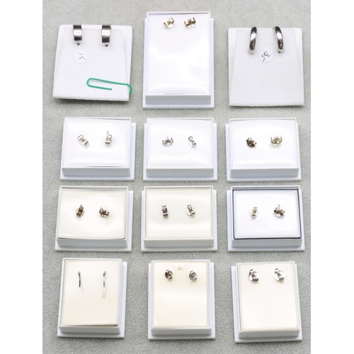 597 - 12 pairs of silver earrings