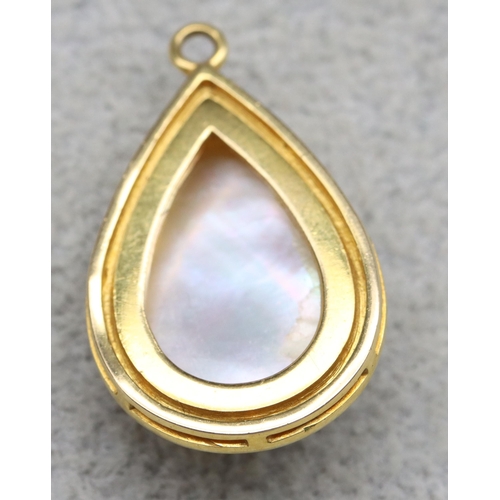 600 - An Indian gold mounted pear shaped pearl drop pendant, 3cm high, 6 grams gross