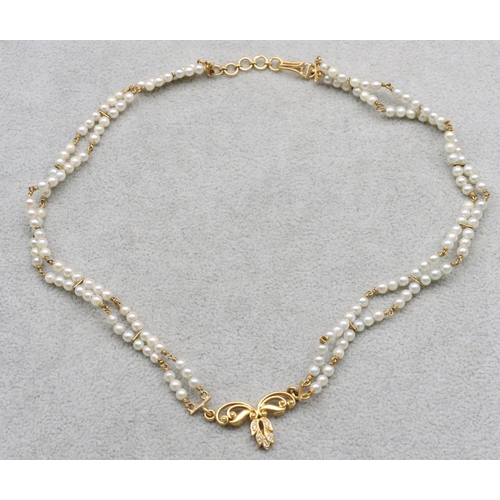 601 - An Indian 22ct gold and pearl double row necklace mounted with 5 small diamonds, 38cm long, 17.1 gra... 