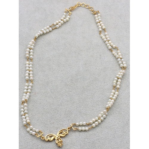 601 - An Indian 22ct gold and pearl double row necklace mounted with 5 small diamonds, 38cm long, 17.1 gra... 