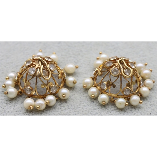 602 - A pair of Indian 22ct gold circular Jhumkha ear drops mounted with pearl and clear stones, 11.4 gram... 