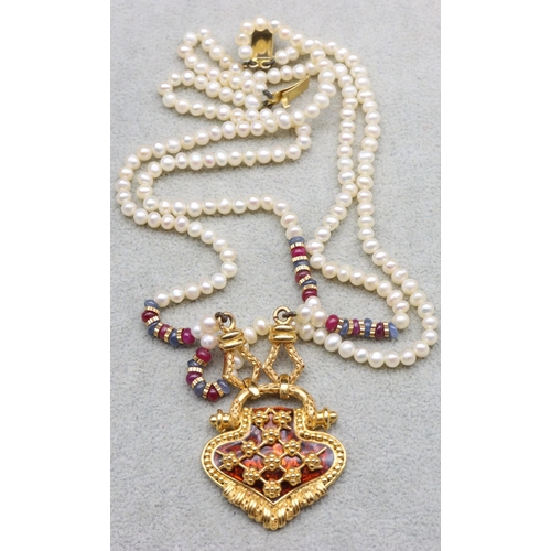 605 - An Indian 22ct gold double row pearl necklace with drop centre with tortoiseshell decoration, pendan... 