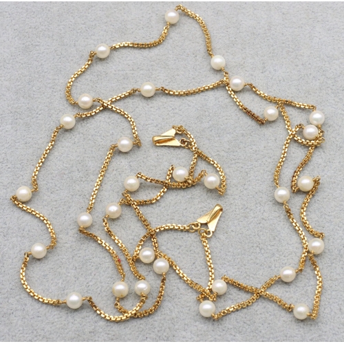 606 - An Indian high carat gold long necklace mounted with 30 pearls with 2 hooks, 30.2 grams gross