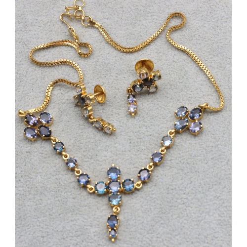 607 - A 22ct gold Indian necklace mounted with pale blue stones, 37cm long and a pair of matching 22ct gol... 