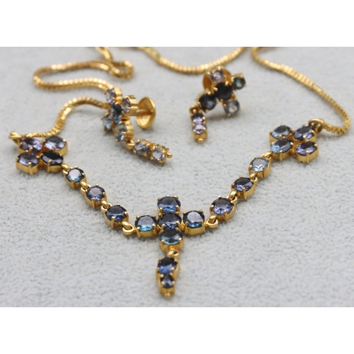 607 - A 22ct gold Indian necklace mounted with pale blue stones, 37cm long and a pair of matching 22ct gol... 