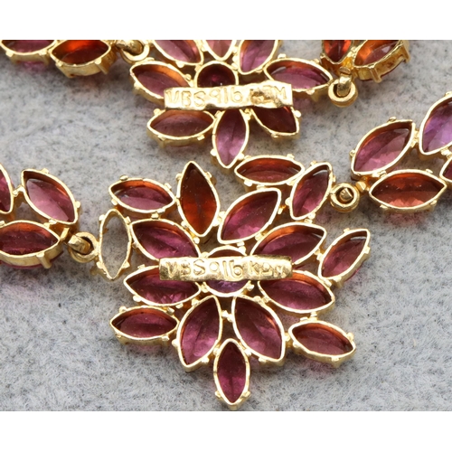 608 - An Indian 22ct gold drop necklace mounted with pink/purple stones, 39.5cm long and a matching bracel... 