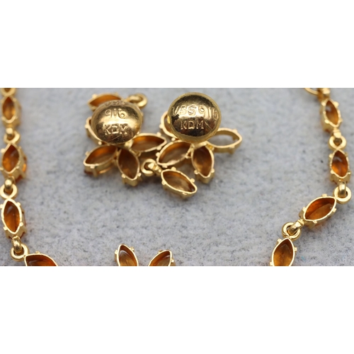 610 - A 22ct gold Indian suite, all mounted with yellow/orange coloured stones, comprising of drop necklac... 