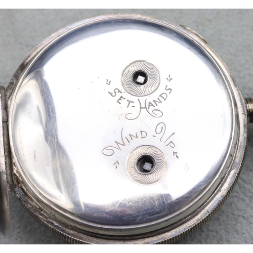 613 - A Chester silver pocket watch with white enamel dial and Roman and Arabic numerals, with locking but... 