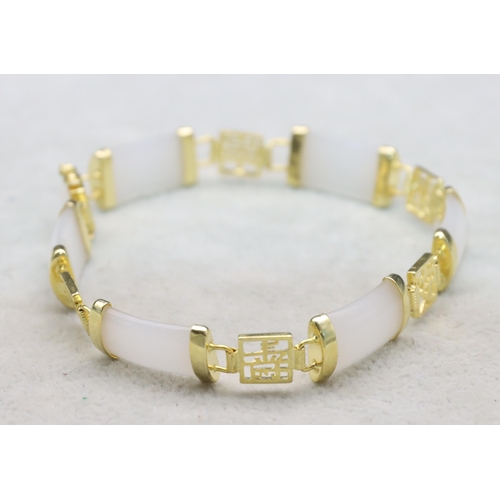 620 - An Oriental white hardstone and gilt Oriental style bracelet, 20cm long