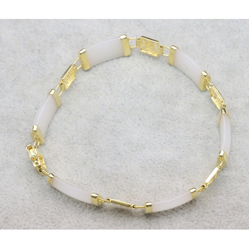 620 - An Oriental white hardstone and gilt Oriental style bracelet, 20cm long