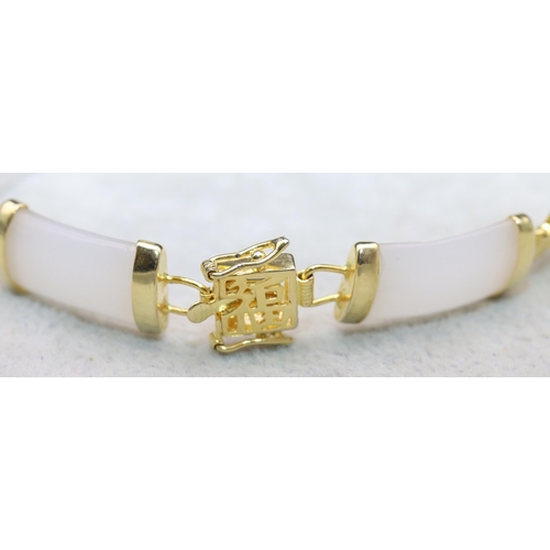 620 - An Oriental white hardstone and gilt Oriental style bracelet, 20cm long