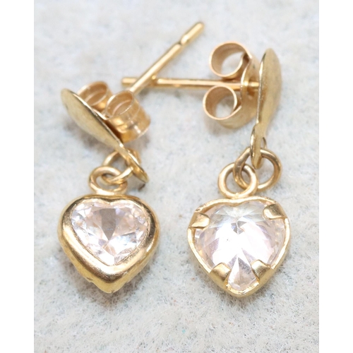 624 - A pair of small 9ct gold heart shaped earrings mounted with purple stones and another pair of gold e... 