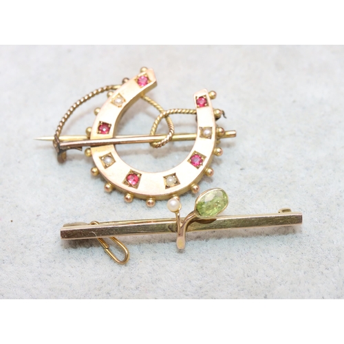 625 - A 9ct gold horseshoe shaped brooch set with small red stones and half pearls and a 9ct gold bar broo... 