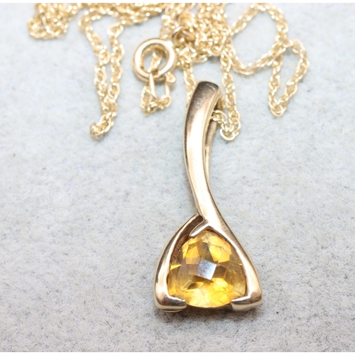 626 - A 9ct gold drop pendant set with yellow stone with 9ct gold chain, 4.4 grams gross