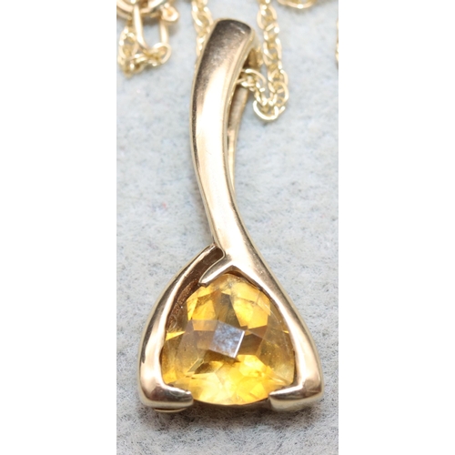 626 - A 9ct gold drop pendant set with yellow stone with 9ct gold chain, 4.4 grams gross