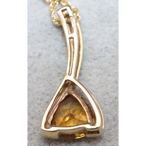 626 - A 9ct gold drop pendant set with yellow stone with 9ct gold chain, 4.4 grams gross