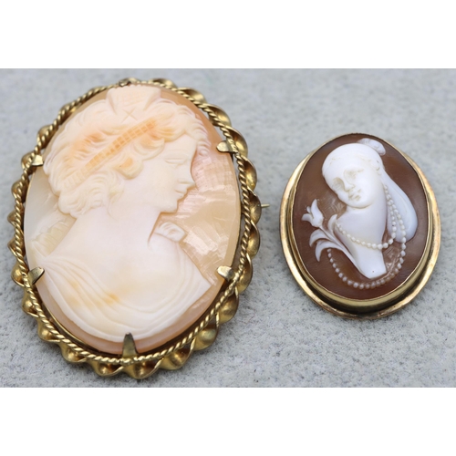 628 - A small gold oval cameo brooch/pendant with raised figurehead of a lady, 3cm high and an oval cameo ... 